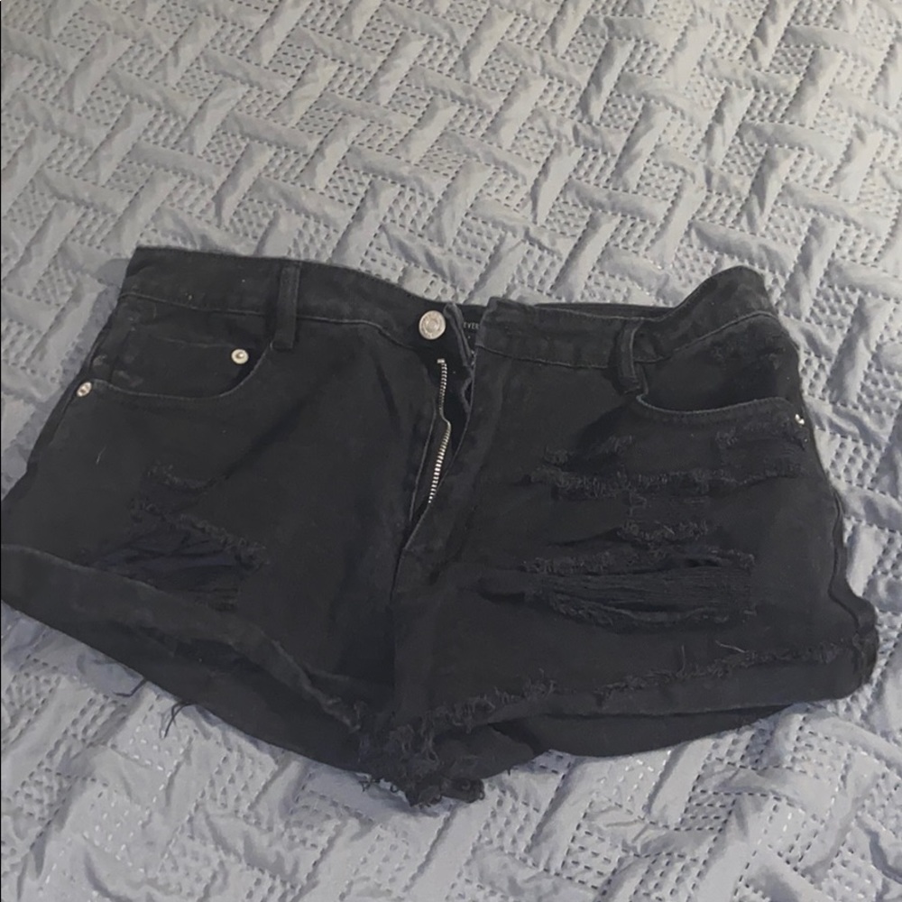 Black ripped shorts